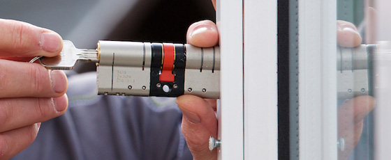 Stephen Fretwell fitting a high-security anti-snap cylinder to a customer's door, providing locksmith services across Waterthorpe and Sheffield.